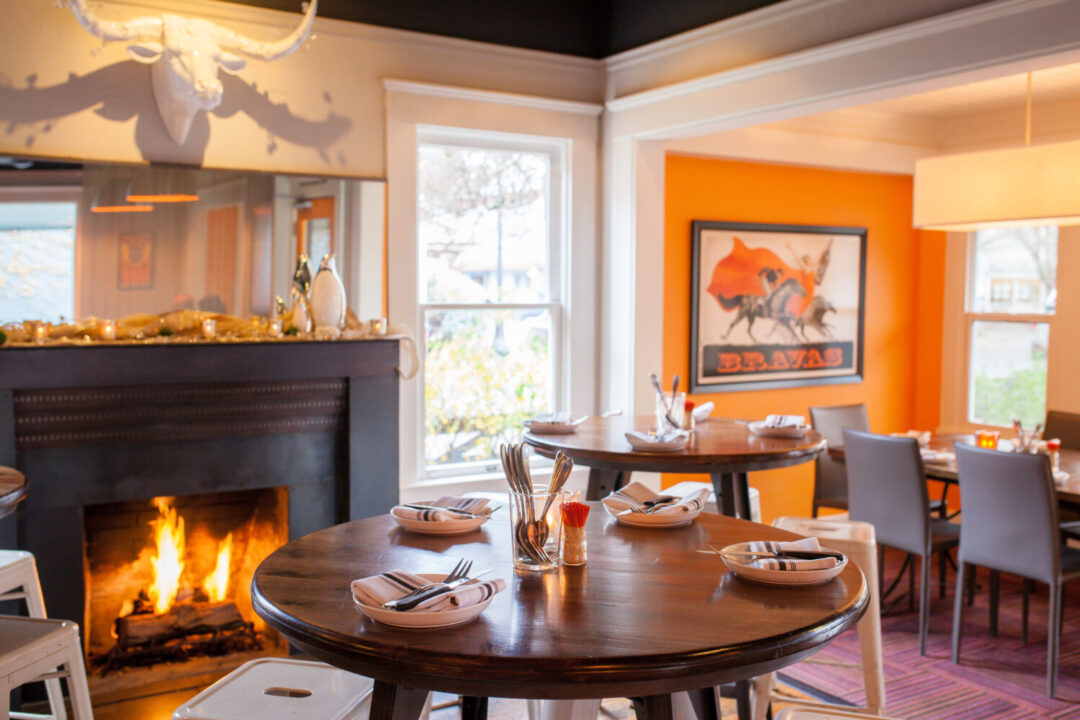 Bravas Bar de Tapas dining room with fireplace | The JetSetting Fashionista
