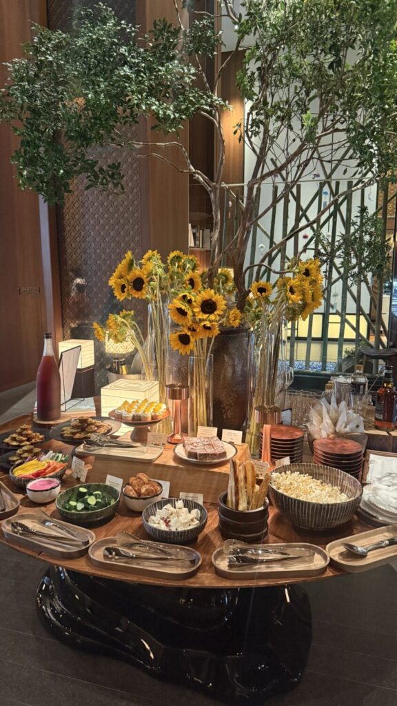 Happy hour spread with sunflowers at Andaz Tokyo Toranomon Hills