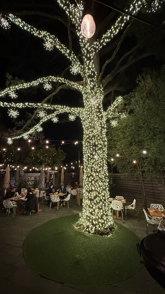 The café-light tree on the Bravas patio at night | The JetSetting Fashionista